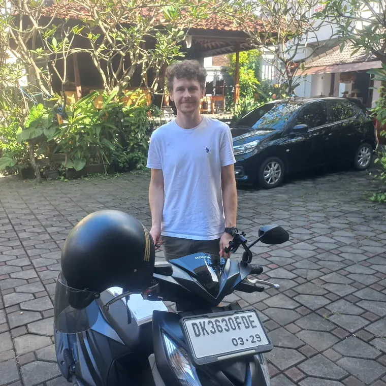 Happy customer with a rented scooter in Bali