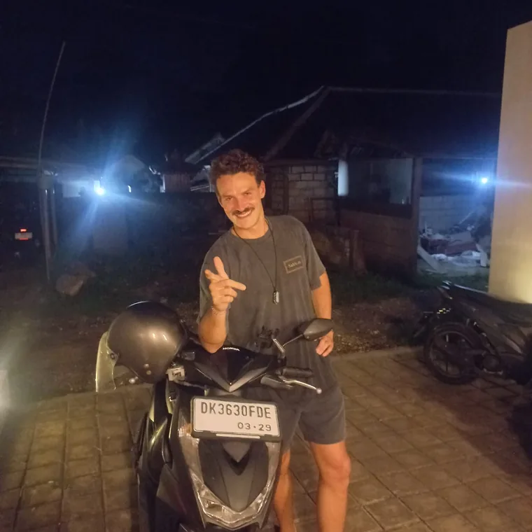 Happy customer with a rented scooter in Bali
