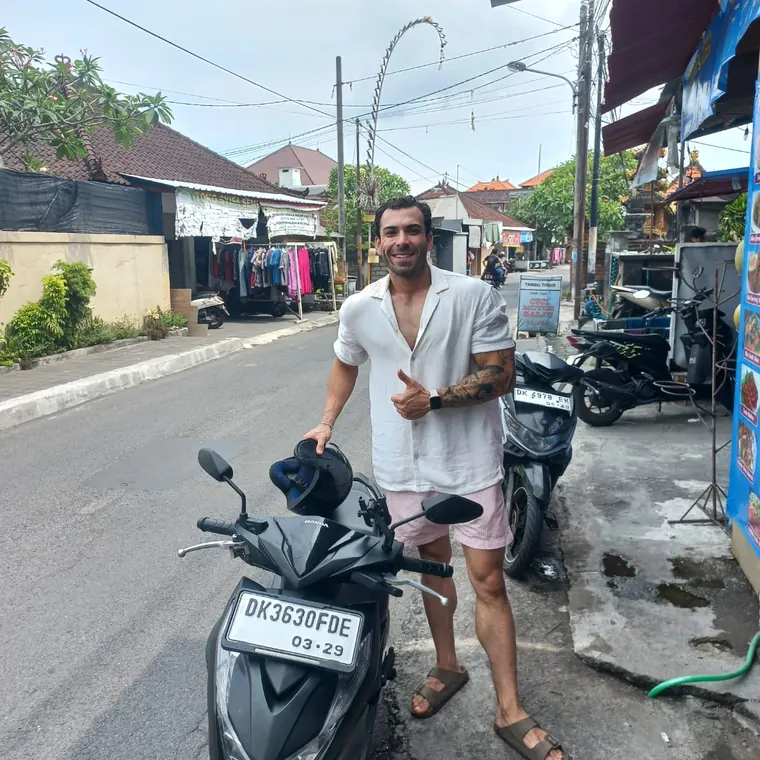 Happy customer with a rented scooter in Bali