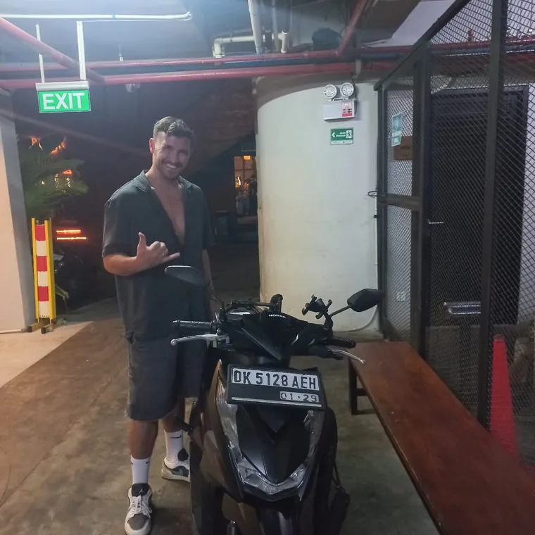 Happy customer with a rented scooter in Bali