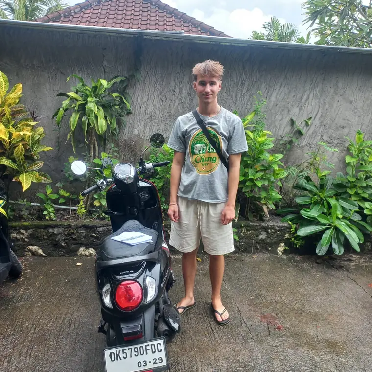 Happy customer with a rented scooter in Bali