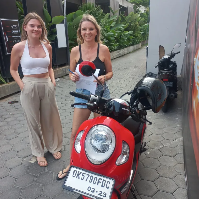 Happy customer with a rented scooter in Bali